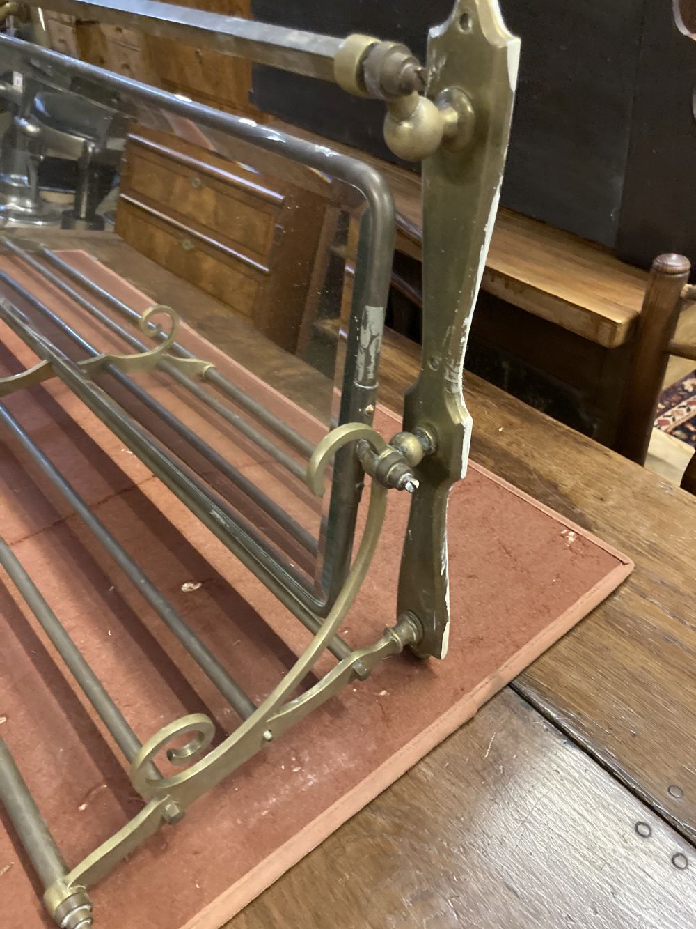 An Edwardian mirrored brass hanging coat and hat rack, width 105cm depth 29cm height 43cm
